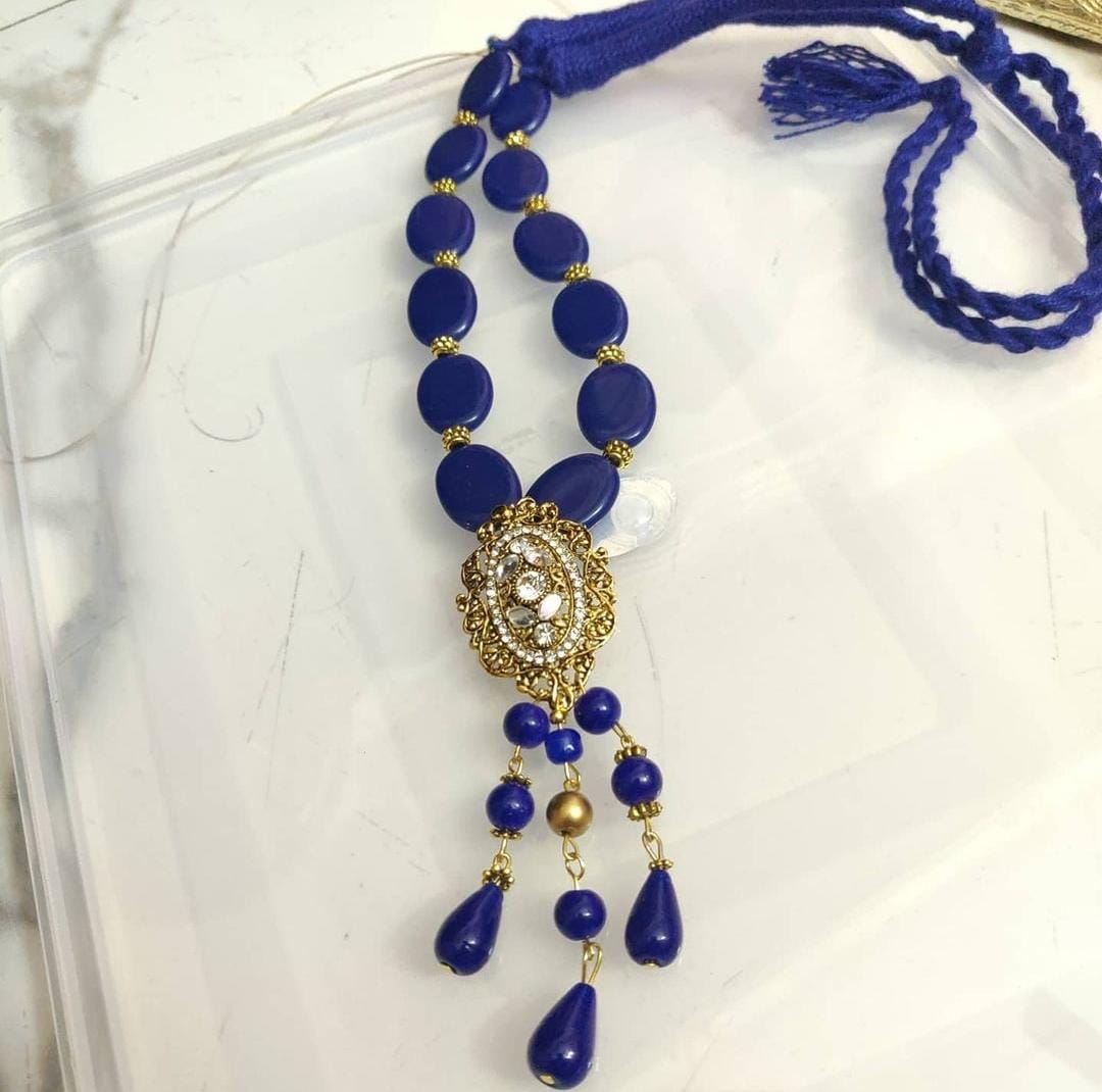 Shadey blue oval beads with Kundan pendant