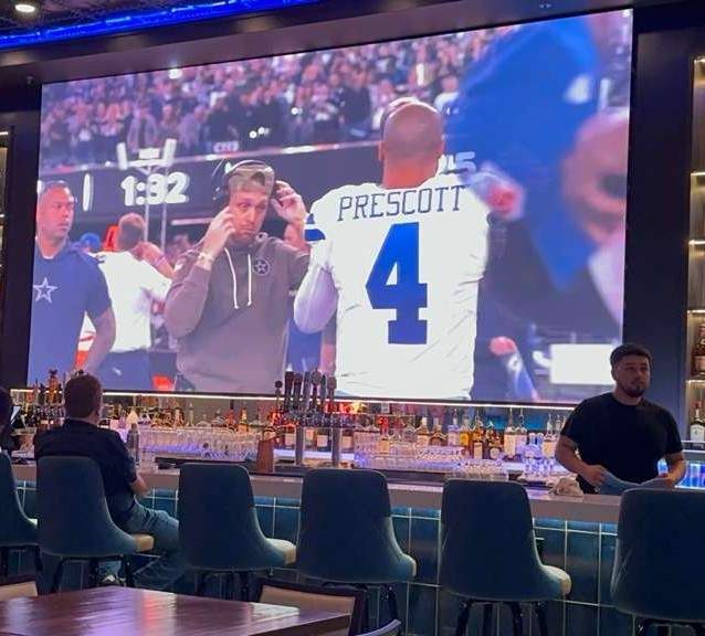 Sports fans watching live games at Bru Sports Bar & Grill